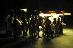Michael Stuparyk/Toronto StarPeople line up at a hotdog stall in a darkened Toronto on August 14. The Ontario premier quickly announced a state of emergency.