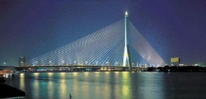 Night view of the bridge, which has a main span 300 metres, and a total span of 475 metres, supported by a 160-metre tall inverted Y-shaped tower. The structure is one of the world's longest asymmetric cable-stayed crossings.
