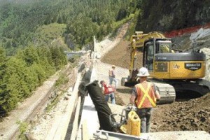 Construction of a test section of the Sea-to-Sky Highway north of Horseshoe Bay, B.C. Associated Engineering did the engineering design; SNC-Lavalin is the owner's engineer for the entire route.