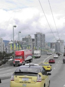 traffic on Cambie Street Bridge, leading over False Creek into the downtown. Cut-and-cover construction for the transit line tunnel will begin south of this point .