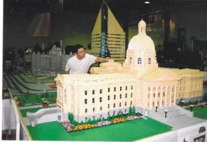 Koob and a 1/40 scale model of the Alberta Legislature building.