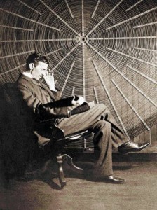 Tesla in front of the spiral coil of his high-frequency transformer.