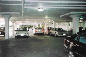 interior of a parkade with few obstructions and light-reflective paint on walls, floor and ceilings to create a bright, open and safe feeling for users.