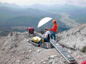 Team members on the summit operate a televiewer to characterize the bedrock conditions.