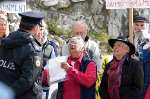 Protestors from the Coalition to Save Eagleridge Bluffs being arrested last May in B.C. The group objects to a new stretch of the Sea-to-Sky highway being constructed near Lions Bay. Photograph by Christopher Grabowski.