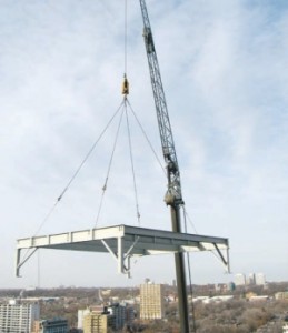 Crane lowers the base for the new combined heat and power plant.