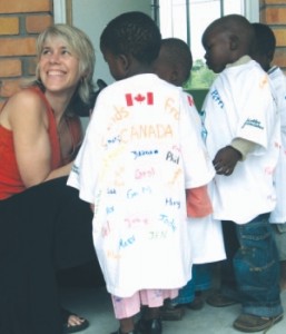 Lea Chambers with children at one of the Golder Trust projects in Africa.