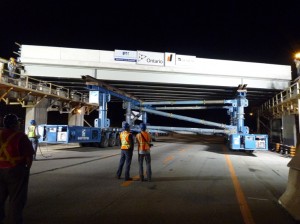 A span being moved into position during the rapid replacement of the Aberdeen Avenue Bridge over Highway 403 in Hamilton, Ontario last July.