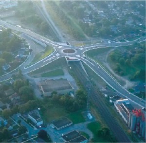 The roundabout is elevated above railway lines that carry 47 trains every day. It has reduced traffic delays and addressed safety concerns for vehicles and pedestrians.